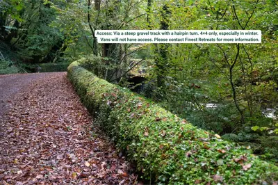 a hedge on the side of a road at Finest Retreats - Pandy Farmhouse in Dolgellau