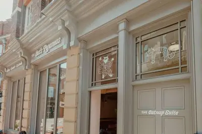 a store front of a shopping center with windows at The Catnap Suite in Shrewsbury
