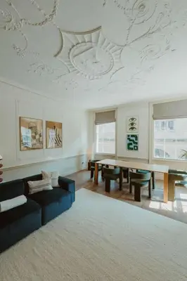 a living room with a couch and a table at The Catnap Suite in Shrewsbury