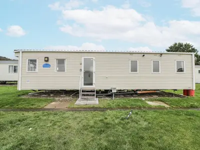 a mobile home in a yard at Brynowen Holiday Park - 22432 in Borth