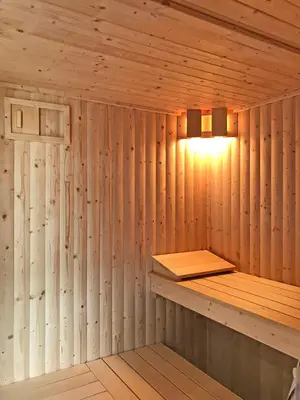 a wooden sauna with a light on the wall at The Hand at Llanarmon in Llanarmon Dyffryn-Ceiriog