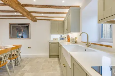 a kitchen with white countertops and wooden ceilings at 4 Bed in Peterchurch oc-s34019 in Peterchurch