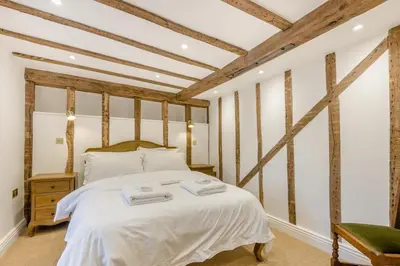 a bedroom with a bed with two towels on it at 4 Bed in Peterchurch oc-s34019 in Peterchurch