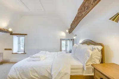 a white bed with white sheets and pillows on it at 4 Bed in Peterchurch oc-s34019 in Peterchurch
