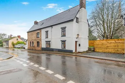 a white house on the side of a street at 4 Bed in Peterchurch oc-s34019 in Peterchurch