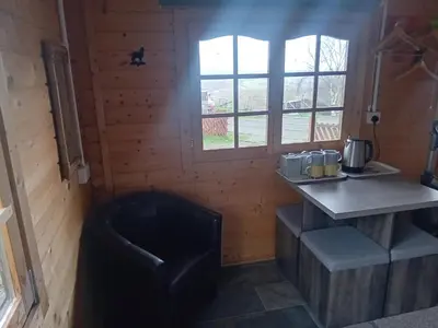 a small kitchen with a counter and a window at Alpaca Hideaway in Newtown