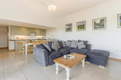 a living room with a blue couch and a table at 1 Bed in Llangower oc-t34142 in Llangower