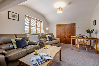 a living room with a couch and a table at 1 Bed in Cilmery oc-g32770 in Builth Road