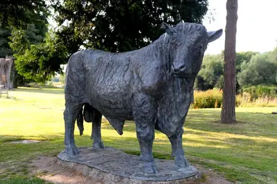 a statue of a cow standing in a park at 1 Bed in Cilmery oc-g32770 in Builth Road