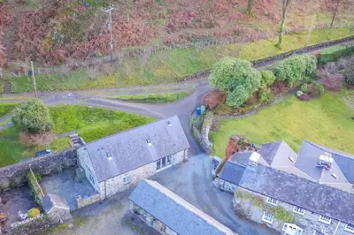 an aerial view of a house and a yard at Coed-Stable in Dolgellau