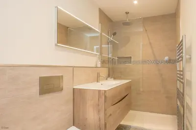 a bathroom with a sink and a shower at Llety-Cariad in Montgomery