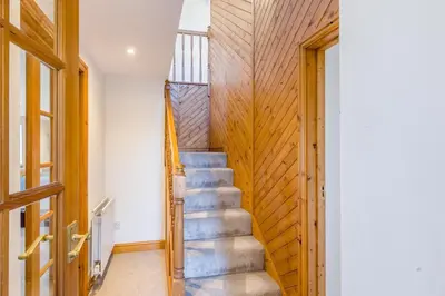 a staircase in a house with a wooden wall at 3 Bed in Rhydyfelin oc-c34178 in Rhyd-y-felin