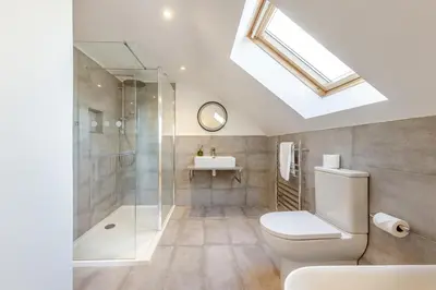 a bathroom with a shower and a toilet and a sink at 3 Bed in Rhydyfelin oc-y34179 in Rhyd-y-felin