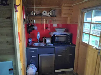 a small kitchen with a sink and a microwave at Moonlight View in Newtown
