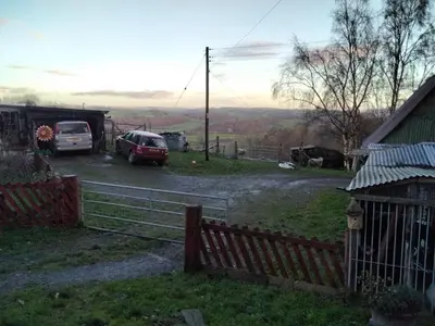 a car parked in a parking lot next to a fence at Moonlight View in Newtown