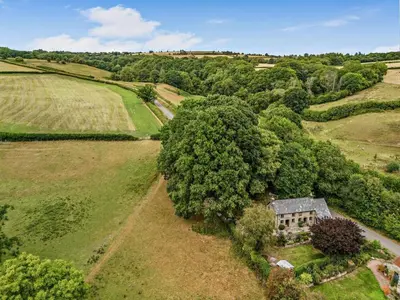 an aerial view of an old house in a field at 2 Bed in Llandefalle oc-n32991 in Llandefalle