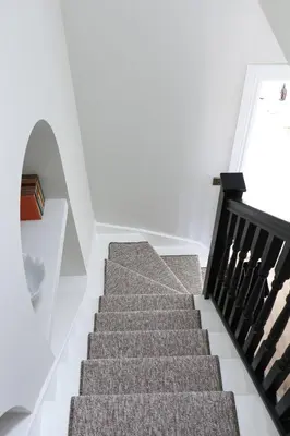 a staircase in a house with white walls at Luxury Apartment in Shropshire sleeps 4 in Shrewsbury