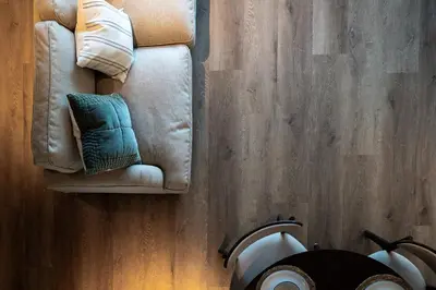 a couch sitting on top of a wooden floor at Luxury Apartment in Shropshire sleeps 4 in Shrewsbury