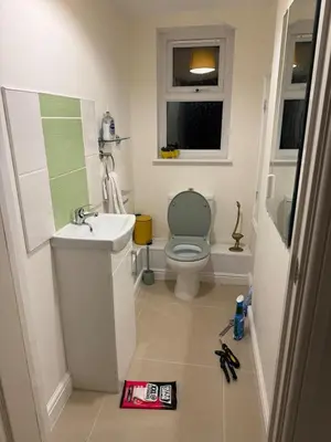 a small bathroom with a toilet and a sink at Swn yr Coed in Sennybridge