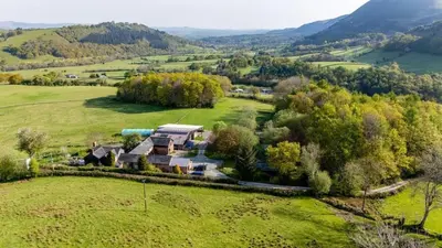 an aerial view of a house in a field at Y Beudy