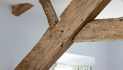 a wooden cross hanging from a ceiling at Y Meirionnydd Boutique Hotel in Dolgellau