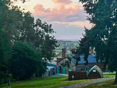 a house with green trim on a grassy hill at Bryn Gwyn - Ukc7801 in Shrewsbury