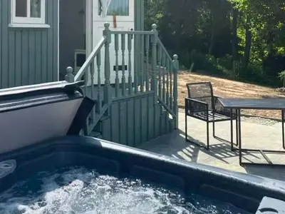 a plunge pool with a table and a chair next to a house at Bryn Gwyn - Ukc7801 in Shrewsbury