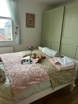 a bedroom with a bed with stuffed animals on it at The Cwtch in Ludlow