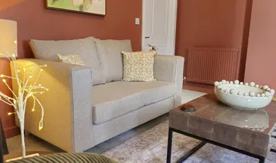 a living room with a couch and a coffee table at Elegant interior-designed ground floor apartment - Pass the Keys in Shrewsbury