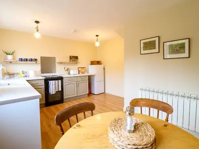 a kitchen and dining room with a table and chairs at 2 Horseshoe Road in Montgomery