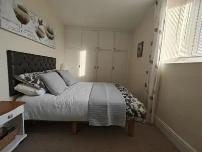a bedroom with a large bed in a room at 2 Bed in Llanelltyd oc-s34505 in Llanelltyd