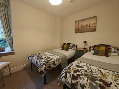 a bedroom with two beds and a window at 2 Bed in Llanelltyd oc-s34505 in Llanelltyd
