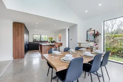 a dining room and living room with a table and chairs at 3 Bed in Leominster oc-w34380 in Leominster