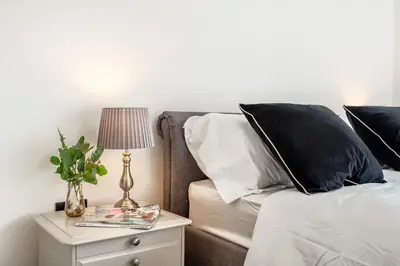a bedroom with a bed and a table with a lamp at 3 Bed in Leominster oc-w34380 in Leominster