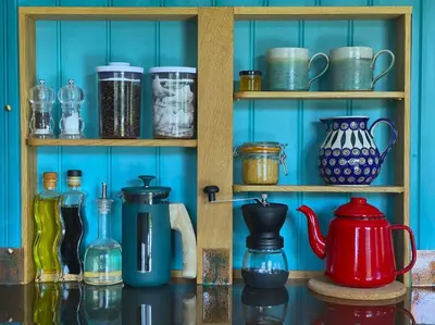a shelf filled with different types of jars and vases at 1 Bed in Llanfihangel-y-Creuddyn oc-c34624 in Llanfihangel-y-creuddyn