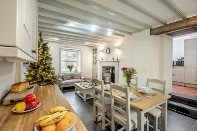 a dining room and living room with a christmas tree at 3 Bed in Islawrdref oc-t34600 in Penmaenpool
