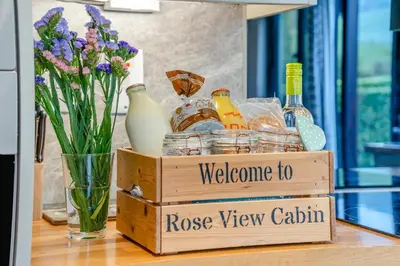 a wooden crate with bottles and a vase of flowers at 2 Bed in Brecon oc-r33603 in Lower Chapel