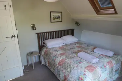 a bedroom with a bed with two pillows on it at Welsh Hideaways in Pentre-briwnant