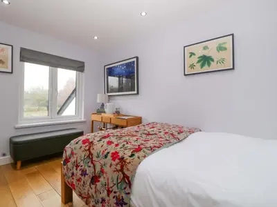 a bedroom with a bed and a window at The Swan in Hereford