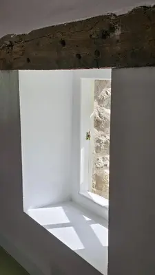 a white room with a window in a building at Abbey Cottages- Red Kite Lodge in Talley