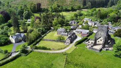 an aerial view of a small village with a mansion at Abbey Cottages- Red Kite Lodge in Talley