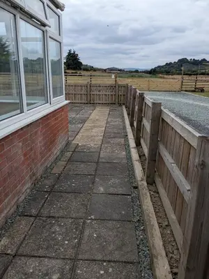 a wooden walkway next to a fence next to a road at Tanyfford Lodge, Abermule, Mid Wales, SY15 6NT in Abermule
