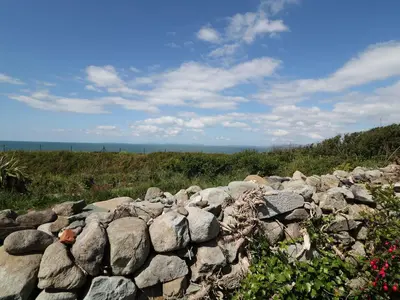 a pile of rocks on top of a field at Goetra in Harlech