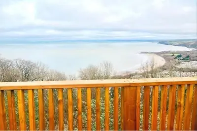 a view of the ocean from the deck of a house at 3 Bed Harbour-view Cottage Sleeps 6 - Dog Friendly in New Quay