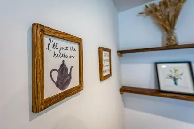 a picture of a cat hanging on a wall at Quaint home with log burner in peaceful cul-de-sac in Shrewsbury