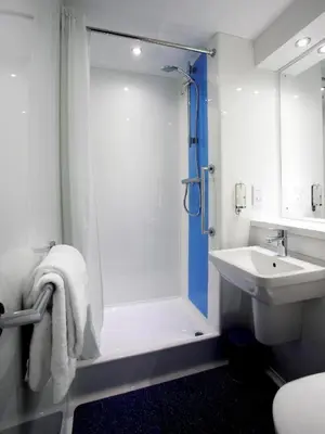 a bathroom with a shower and a sink at Travelodge Ludlow in Ludlow
