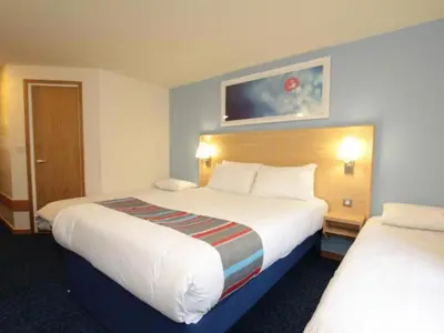 a hotel room with two beds at Travelodge Ludlow Woofferton in Brimfield