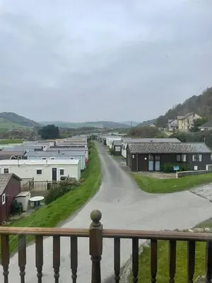 a view from a balcony of a town with houses at Sea and Bay Viev Luxury Lodge in Clarach bay in Aberystwyth