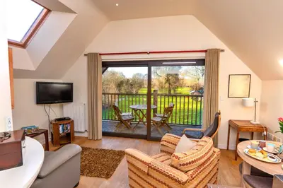 a living room with a couch and chairs at Finest Retreats - Canal Central in Ball