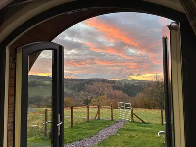 a view from a train window of a field at Four Paws Glamping in Aberystwyth